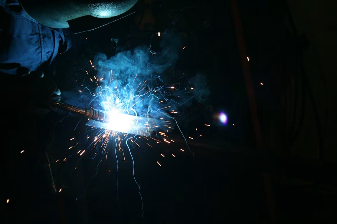 Welding sparks in a dark workshop
